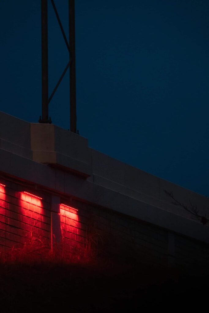 Photograph of an industrial building at night