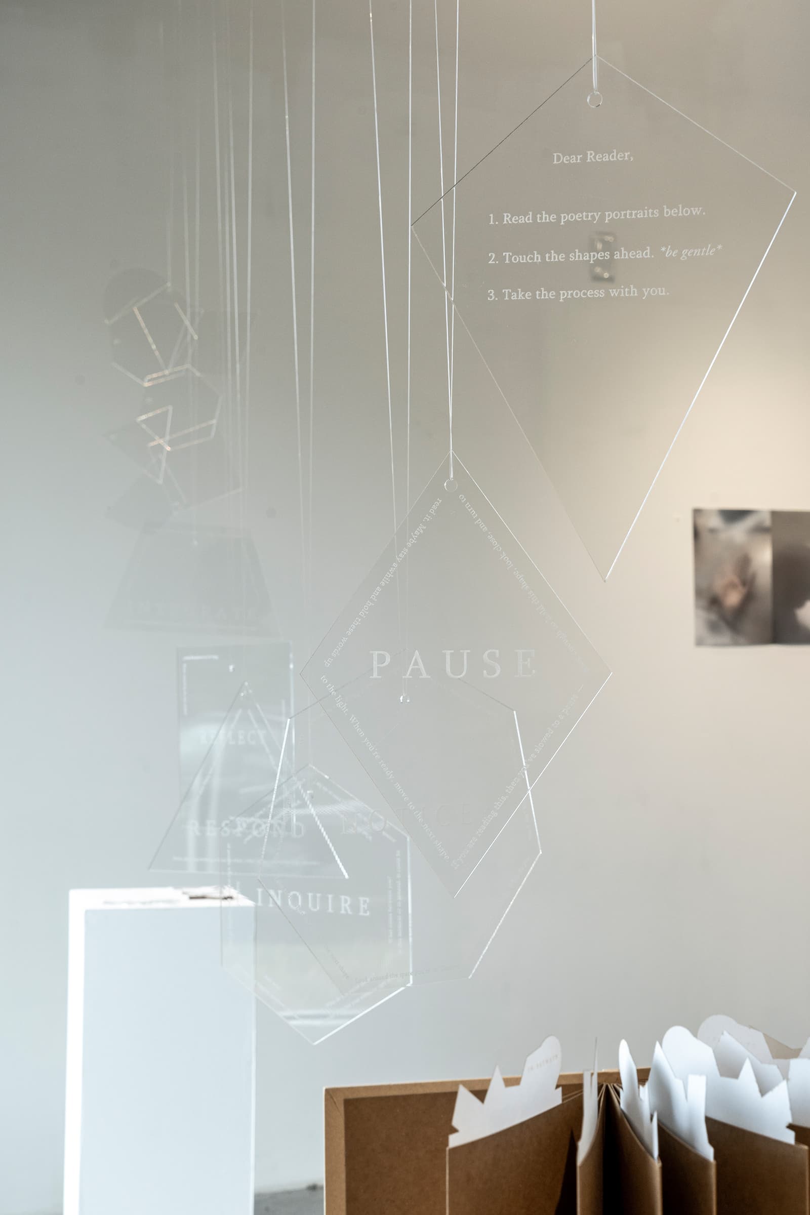 Pause poetry installation on acrylic panels