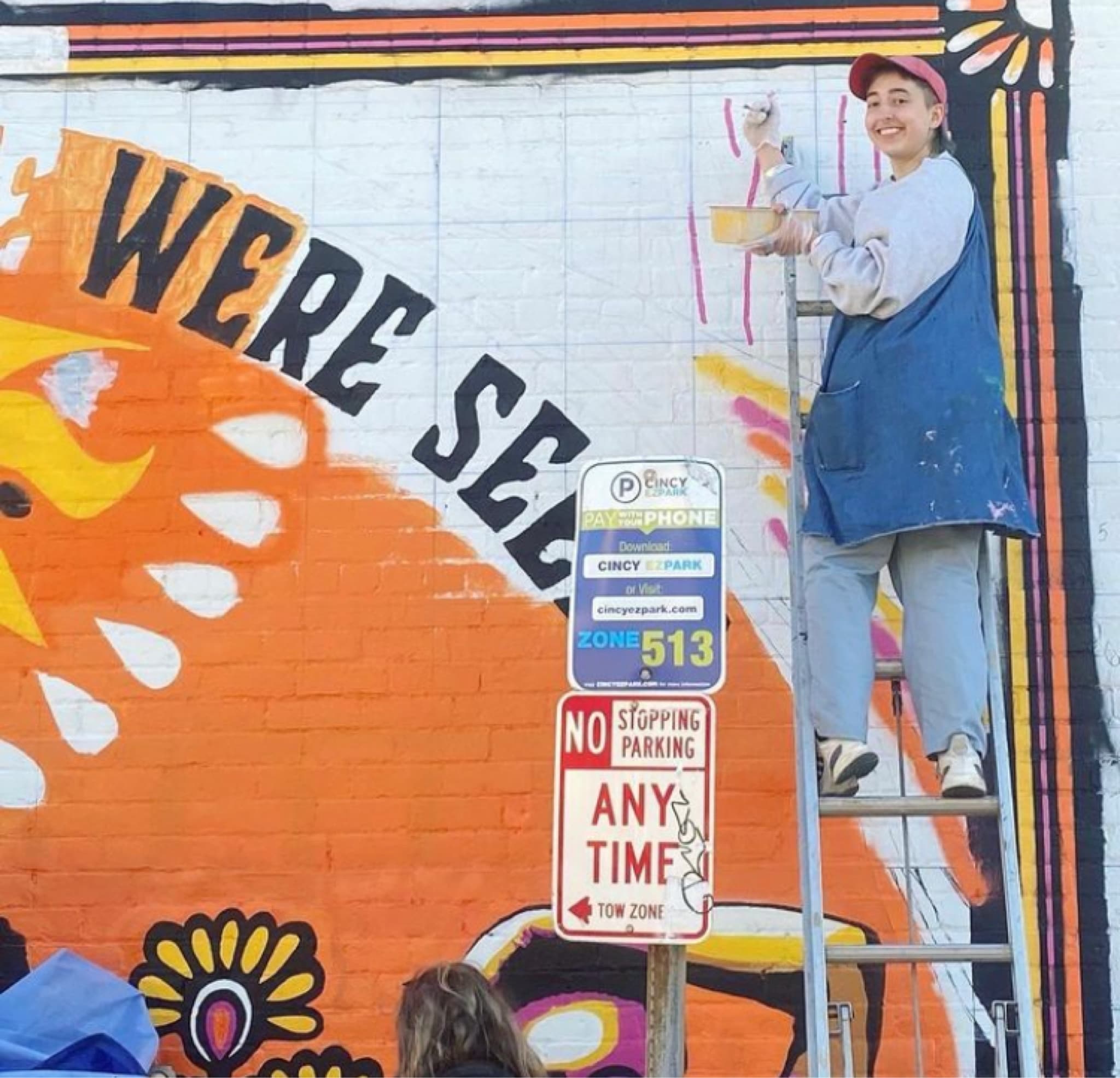 Monte painting a mural